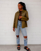 This Valentino jacket brings the class and the finest green leather, all wrapped up in one slick package! The only catch? No working zip (check out the last two photos to get the full scoop)! But don't let a defected zipper keep you from rocking the look!