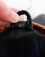 Introducing this Vintage 80s black fireman clasp leather coat, a must-have piece for your collection. Made of buttery soft leather, this coat exudes a cool and edgy vibe.