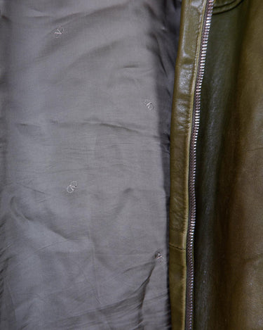 This Valentino jacket brings the class and the finest green leather, all wrapped up in one slick package! The only catch? No working zip (check out the last two photos to get the full scoop)! But don't let a defected zipper keep you from rocking the look!