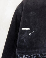 This vintage black leather coat blends matte suede leather with subtly glossy smooth leather panels in rich black tones. The unique patchwork design, featuring delicate dot-textured sections, adds depth, texture, and quiet individuality. With its sleek cut, button front, and spacious pockets, this timeless piece is full of character – perfect for those who appreciate quality and one-of-a-kind style.