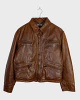 Fall in love with this italian vintage 80s brown leather jacket! With its classic look, warm wool lining, and thick leather material, you'll look and feel great while staying cozy!