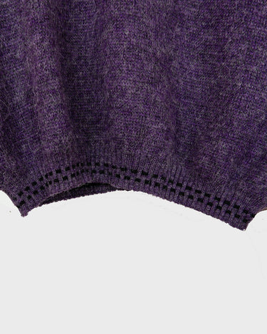 This vintage 80s sweater is sure to add a splash of purple passion to any wardrobe! Crafted from a blend of alpaca, lana wool and acryl mix this sweater is perfect to survive the cold winter days. 
