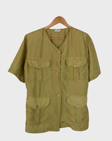 Who says shoulder pads are a thing of the past? Take a walk on the wild side and grab this vintage 80s golden (light greenish undertone) silk blouse with confidence!