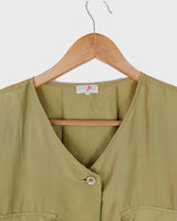 Who says shoulder pads are a thing of the past? Take a walk on the wild side and grab this vintage 80s golden (light greenish undertone) silk blouse with confidence!