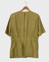 Who says shoulder pads are a thing of the past? Take a walk on the wild side and grab this vintage 80s golden (light greenish undertone) silk blouse with confidence!