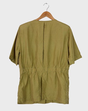 Who says shoulder pads are a thing of the past? Take a walk on the wild side and grab this vintage 80s golden (light greenish undertone) silk blouse with confidence!
