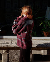 Add a pop of pink to your wardrobe with our vintage 80s wool sweater, featuring a geometric pattern.