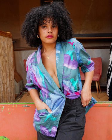 Shimmer your way into summer with this colorful Premium Marina Rinaldi shortsleeve jacket! This 80s inspired jacket is so thin, that you'll almost forget you're wearing it!