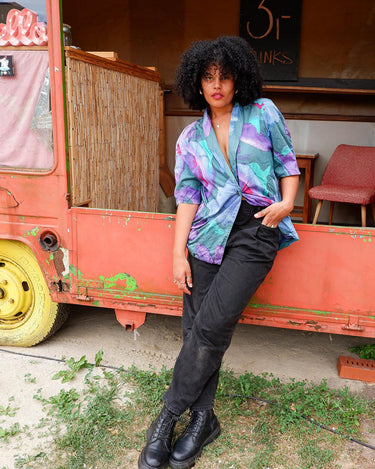 Shimmer your way into summer with this colorful Premium Marina Rinaldi shortsleeve jacket! This 80s inspired jacket is so thin, that you'll almost forget you're wearing it!