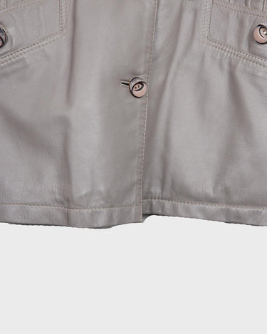 This grey spring coat combines vintage vibes with shoulder pads for a touch of 80s flair.