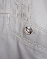 This grey spring coat combines vintage vibes with shoulder pads for a touch of 80s flair.