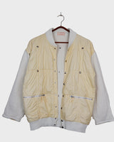 Rare 80s collab between French art rebel Castelbajac and Italian luxury label ICEBERG. A bold mix of soft knit sleeves and lightweight woven fabric, detailed with silver snaps and zip pockets. Playful, offbeat, and seriously collectible.