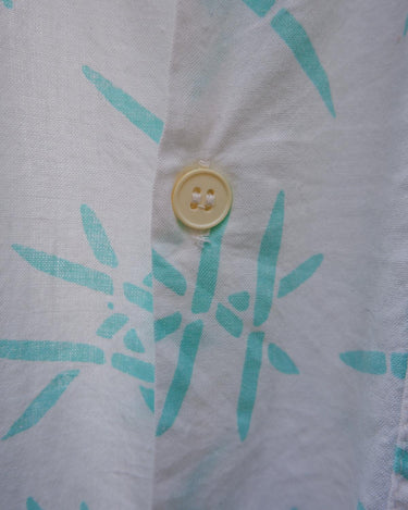 Sun’s out, button up! This Italian vintage white polo shirt brings serious 80s energy with its sharp button-up neckline and eye-catching turquoise pattern. A rare vintage gem that’s equal parts sporty, stylish, and a little cheeky. Wear it loud, wear it proud – this polo’s got main character energy.