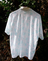 Sun’s out, button up! This Italian vintage white polo shirt brings serious 80s energy with its sharp button-up neckline and eye-catching turquoise pattern. A rare vintage gem that’s equal parts sporty, stylish, and a little cheeky. Wear it loud, wear it proud – this polo’s got main character energy.