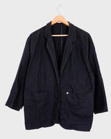 If you’re looking for a timeless piece, you can’t go wrong with this Vintage 90s linen x cotton black blazer. Crafted in Morocco, you’ll be making a statement of effortless elegance in no time!