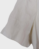 Slip into effortless luxury with this vintage Max Mara pure linen blouse — straight from the golden age of 90s Italian fashion. With its sharp lapels, sculpted silhouette, and waist-defining belt, it’s pure understated power dressing. Made from 100% premium linen, it’s light, luxe, and built for those sun-drenched days. Vintage Max Mara never goes out of style.