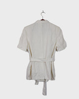 Slip into effortless luxury with this vintage Max Mara pure linen blouse — straight from the golden age of 90s Italian fashion. With its sharp lapels, sculpted silhouette, and waist-defining belt, it’s pure understated power dressing. Made from 100% premium linen, it’s light, luxe, and built for those sun-drenched days. Vintage Max Mara never goes out of style.