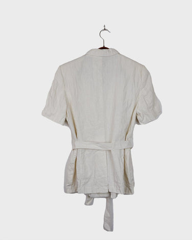 Slip into effortless luxury with this vintage Max Mara pure linen blouse — straight from the golden age of 90s Italian fashion. With its sharp lapels, sculpted silhouette, and waist-defining belt, it’s pure understated power dressing. Made from 100% premium linen, it’s light, luxe, and built for those sun-drenched days. Vintage Max Mara never goes out of style.