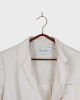 Slip into effortless luxury with this vintage Max Mara pure linen blouse — straight from the golden age of 90s Italian fashion. With its sharp lapels, sculpted silhouette, and waist-defining belt, it’s pure understated power dressing. Made from 100% premium linen, it’s light, luxe, and built for those sun-drenched days. Vintage Max Mara never goes out of style.