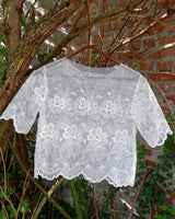 Ditch the boring basics—this handmade lace top is crafted from upcycled curtains. With its romantic vibes, sheer elegance, and intricate embroidery, it’s perfect for layering and embracing your boho side. This one-of-a-kind piece is sustainably made and packed with attitude. Who knew curtains could slay this hard?