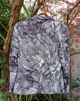 Make a statement with this vintage Escada blazer—bold, tailored, and anything but ordinary. Its detailed monochrome botanical print and iconic Escada cut turn timeless elegance into something effortlessly cool. A rare secondhand gem for lovers of slow fashion and sharp silhouettes, this piece brings instant edge to any outfit. Vintage luxury, with attitude.