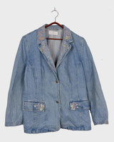 Add a touch of personality to your wardrobe with our Vintage 90s blue denim blazer. Featuring playful splashes of colorful pearls, this blazer exudes a fairy-like charm!
