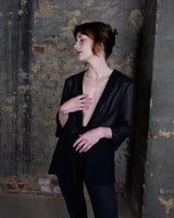 See-through but never low-key – this sheer lace-up jacket brings attitude with every detail. The transparent fabric meets lacing for a look that’s anything but basic. A y2k piece that speaks for itself.