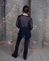 See-through but never low-key – this sheer lace-up jacket brings attitude with every detail. The transparent fabric meets lacing for a look that’s anything but basic. A y2k piece that speaks for itself.