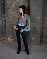 Inspired by the free-spirited vibe of the 70s, this boho paisley-patterned silk-blend tie crop-fit blouse features flared sleeves and a breezy silhouette. Lightweight, very thin, colorful and perfect for sizes XS to S. Throw it on, tie it up, and let your outfit do the talking.