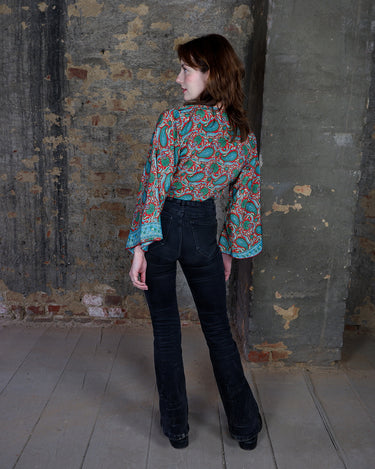 Inspired by the free-spirited vibe of the 70s, this boho paisley-patterned silk-blend tie crop-fit blouse features flared sleeves and a breezy silhouette. Lightweight, very thin, colorful and perfect for sizes XS to S. Throw it on, tie it up, and let your outfit do the talking.