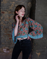 Inspired by the free-spirited vibe of the 70s, this boho paisley-patterned silk-blend tie crop-fit blouse features flared sleeves and a breezy silhouette. Lightweight, very thin, colorful and perfect for sizes XS to S. Throw it on, tie it up, and let your outfit do the talking.