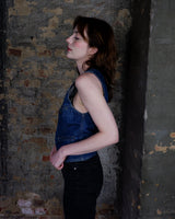 This vintage denim vest is tough, timeless, and ready to layer. It features classic brass snap buttons and four front pockets for that old-school workwear vibe.