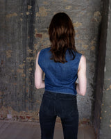This vintage denim vest is tough, timeless, and ready to layer. It features classic brass snap buttons and four front pockets for that old-school workwear vibe.