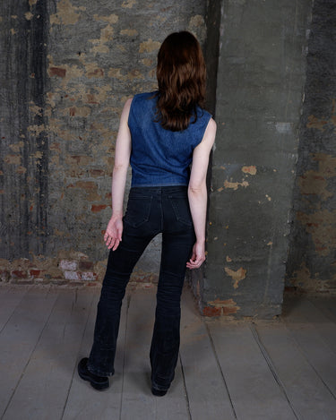 This vintage denim vest is tough, timeless, and ready to layer. It features classic brass snap buttons and four front pockets for that old-school workwear vibe.
