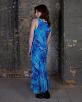 Soft shades of blue and a flowing cut give this 90s maxi dress an easy, fairy-like feel. The asymmetrical hem adds just enough edge to keep it from being too sweet.