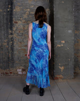 Soft shades of blue and a flowing cut give this 90s maxi dress an easy, fairy-like feel. The asymmetrical hem adds just enough edge to keep it from being too sweet.