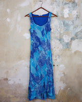 Soft shades of blue and a flowing cut give this 90s maxi dress an easy, fairy-like feel. The asymmetrical hem adds just enough edge to keep it from being too sweet.