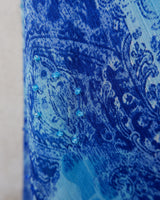 Soft shades of blue and a flowing cut give this 90s maxi dress an easy, fairy-like feel. The asymmetrical hem adds just enough edge to keep it from being too sweet.