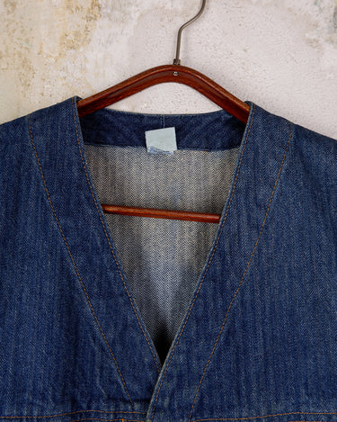 This vintage denim vest is tough, timeless, and ready to layer. It features classic brass snap buttons and four front pockets for that old-school workwear vibe.