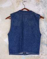 This vintage denim vest is tough, timeless, and ready to layer. It features classic brass snap buttons and four front pockets for that old-school workwear vibe.