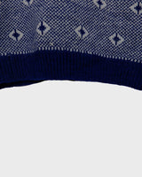 Snuggle up in this ultra-cozy handknitted woolly slipover!