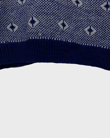 Snuggle up in this ultra-cozy handknitted woolly slipover!