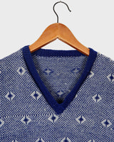 Snuggle up in this ultra-cozy handknitted woolly slipover!