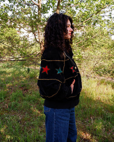Introducing the ultimate premium jacket for all the 80s lovers out there - the 80s Vintage Dino'z bomber leather jacket with colorful stars! 