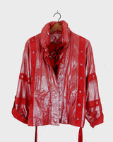 Add a touch of sparkle to your wardrobe with this premium vintage 80s red glitter lamb skin jacket (thin). The belted design offers a flattering fit, while the soft and supple leather provides luxurious comfort!