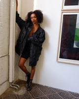 Make a statement with this timeless vintage black nappa leather coat. Crafted from fine leather and designed to flatter, this versatile piece will keep you warm with adjustable tie waist and provide a classic yet modern look. Get ready to stand out!