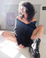 Get cozy with this vintage 80s black traditional cardigan! With its classic design and comfortable fit, this cardigan is perfect for chilly nights.