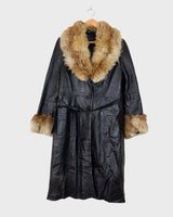 Let your 70s style heart shine with this Vintage 70s black leather penny lane coat with real fur. It features a thin leather that keeps you warm and comfy while you rock that sweet '70s vibe.