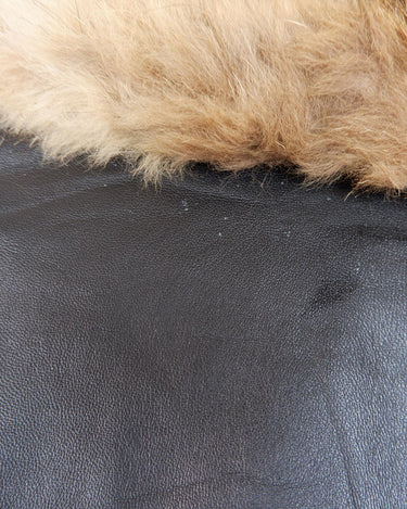 Let your 70s style heart shine with this Vintage 70s black leather penny lane coat with real fur. It features a thin leather that keeps you warm and comfy while you rock that sweet '70s vibe.