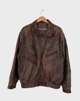 Revive the '80s look with this vintage brown used look leather jacket! It's been around the block, but there's still plenty of life in it enough to make a statement that'll stand the test of time. Please keep in mind, that the inner lining of the leather jacket is full of discoloration and cracks that have been sewn up (condition 4/10 for the inner lining). Please have a look at the last 3 photos for the inner lining.